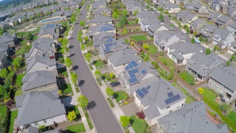 An-aerial-image-over-a-vast-subdivision-of-housing-units-in-a-neighborhood
