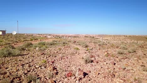 Aerial-drone-shot-reveals-the-outback-bush-opal-mining-town-of-Coober-Pedy-Australia