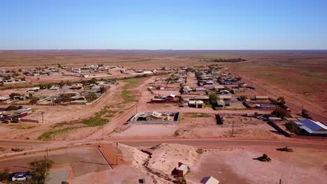 Aerial-drone-shot-reveals-the-outback-bush-opal-mining-town-of-Coober-Pedy-Australia-4