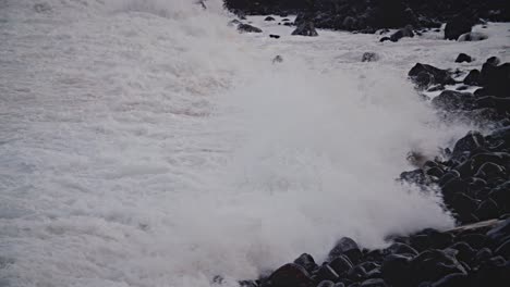 Large-waves-roll-into-the-coast-of-Hawaii-in-slow-motion-and-break-along-a-rocky-shore