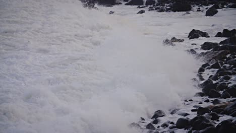 Large-waves-roll-into-the-coast-of-Hawaii-in-slow-motion-and-break-along-a-rocky-shore-1