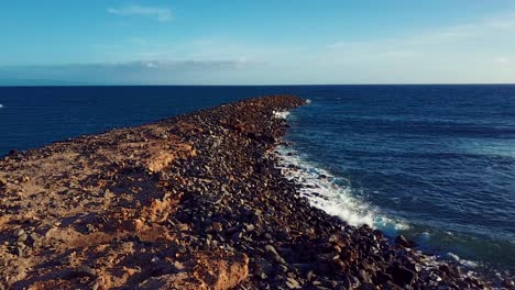 Nice-aerial-shot-over-rocky-Molokai-Hawaii-beach-and-coastline
