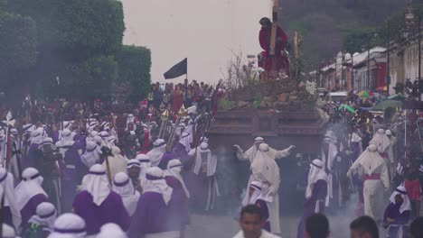 Robed-priests-carry-giant-coffins-in-a-colorful-Christian-Pascua-celebration-in-Antigua-Guatemala-1
