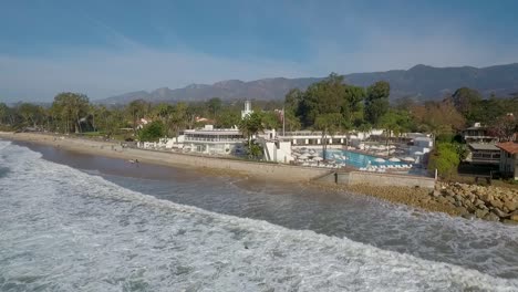 Beautiful-aerial-of-Butterfly-Beach-the-Pacific-and-the-Coral-Casino-in-Montecito-California