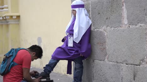 Young-cucharucho-gets-a-shoe-shine-Holy-Week-in-Antigua-Guatemala