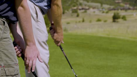 A-close-up-shot-of-young-boys-taking-golf-lessons-1