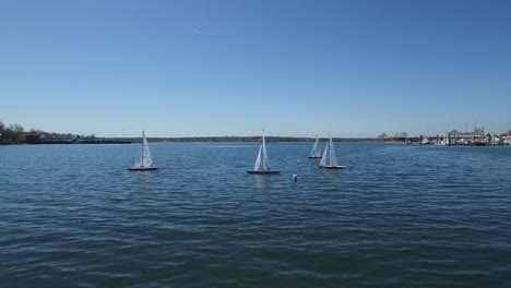 An-aerial-over-toy-sailboats-floating-on-a-lake