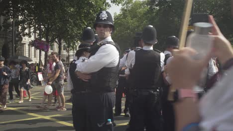 English-Police-Watch-As-Huge-Crowds-Of-Protesters-Gather-On-The-Streets-Of-London-To-Protest-The-Visit-Of-US-President-Donald-Trump