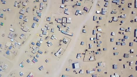 Vista-Aérea-over-a-strange-abandoned-town-of-empty-lonely-suburban-tract-houses-in-the-desert-of-Namibia-Africa-4