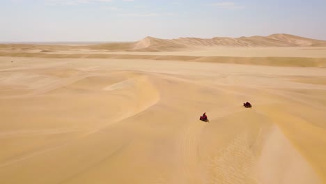 Good-aerials-over-ATV-vehicles-speeding-across-the-desert-sand-dunes-in-Namibia-Africa