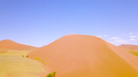 Vista-Aérea-over-rugged-desert-landscape-and-sand-dunes-near-Dune-45-in-Namibia-Africa