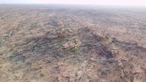 Aerial-moves-towards-petroglyphs-and-cave-art-at-Hargeisa-Somalia-to-reveal-landscape