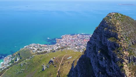 Aerial-shot-over-the-top-of-Lion's-Head-mountain-peak-reveals-Cape-Town-South-Africa