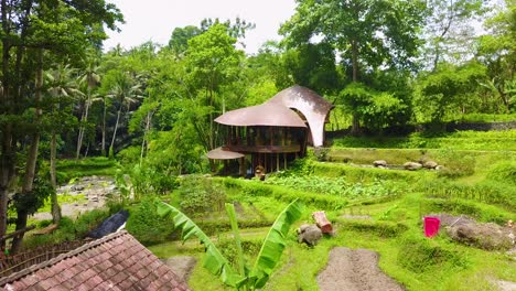 Vista-Aérea-move-in-on-a-fantastic-rounded-architectural-house-in-the-jungles-of-Bali-Indonesia