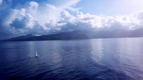 Beautiful-aerial-of-a-sailboat-sailing-across-the-Caribbean-ocean-sea-near-the-island-of-St-Lucia-1