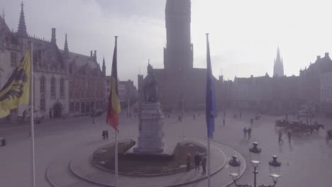 Aerial-of-a-mysterious-foggy-day-through-a-central-square-in-Bruges-Belgium-1