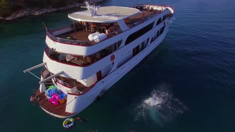 Swimmers-and-partiers-jump-off-a-large-yacht-or-boat-in-the-Adriatic-Sea-near-Croatia-during-a-yacht-party-1