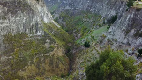 Aerial-shot-deep-canyon-near-Quilotoa-Ecuador-caldera-in-the-Andes-Mountains