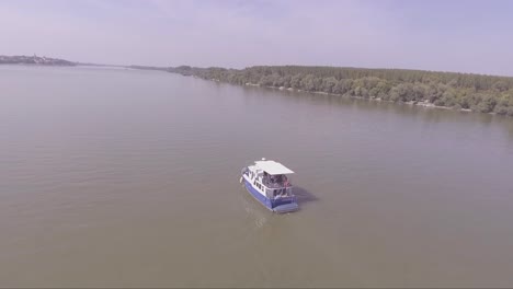 Aerial-of-a-boat-traveling-on-the-Danube-or-Sava-River-near-Belgrade-Serbia