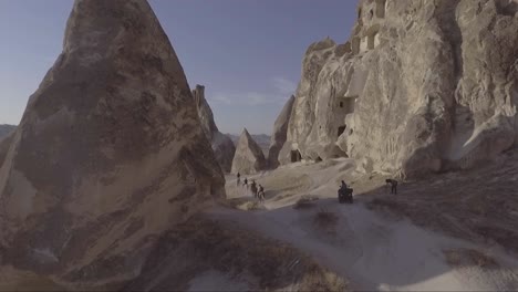 Aerial-of-tourists-riding-horses-horseback-riding-at-Cappadocia-Turkey