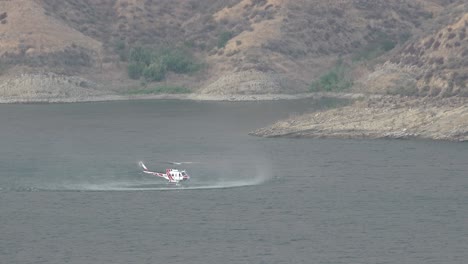 Helicopter-Refilling-Water-Drop-After-A-Brushfire-Holser-Fire-Burns-A-Hillside-Near-Lake-Piru-California-6