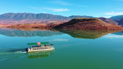 Aerial-Over-Pontoon-Tourist-Boat-On-Lake-Bin-El-Ouidane-Morocco-1