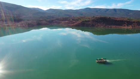 Aerial-Over-Pontoon-Tourist-Boat-On-Lake-Bin-El-Ouidane-Morocco-4