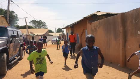 Children-Run-In-Slow-Motion-On-A-Dirt-Road-In-West-Africa