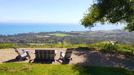 Aerial-Over-Outdoor-Furniture-And-View-Of-Carpinteria-California-And-Establishing-Santa-Barbara-Coastline-Below