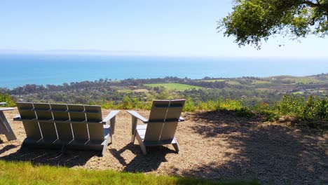 Aerial-Over-Outdoor-Furniture-And-View-Of-Carpinteria-California-And-Establishing-Santa-Barbara-Coastline-Below-1