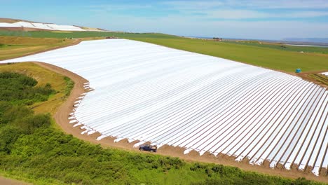 Aerial-Of-Rows-Of-Plastic-Covering-On-Farm-Fields-Near-Santa-Maria-California