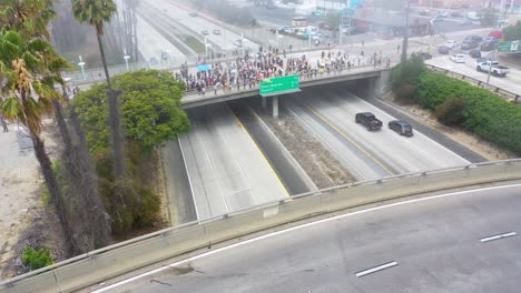High-Aerial-Over-Large-Crowds-On-Freeway-Overpass-Black-Lives-Matter-Blm-Protest-In-Ventura-California
