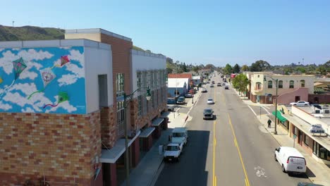 Aerial-Over-The-Avenue-Section-Of-Ventura-California-From-Kite-Mural-To-Street-Businesses-And-Offices-Visible-Southern-California-Or-Los-Angeles-1
