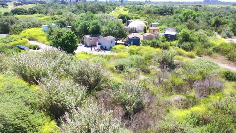 Aerial-Of-Storage-Sheds-Converted-Into-Homeless-Encampments-In-The-River-Bed-Area-Of-Ventura-Oxnard-California-1