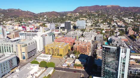 Aerial-Of-Downtown-Hollywood-California-With-The-Hollywood-Sign-Distant