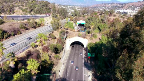 Aerial-Freeway-Cars-Travel-Along-The-110-Freeway-In-Los-Angeles-Through-Tunnels-And-Towards-Downtown-Skyline-5