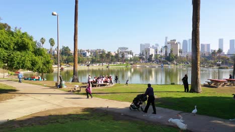 Aerial-Of-People-Having-Picnic-And-Walking-At-Macarthur-Park-Lake-Near-Downtown-Los-Angeles-California-Wishire-District