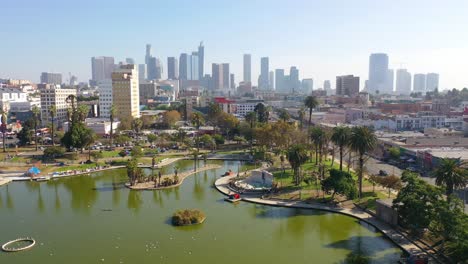 Aerial-Of-Macarthur-Park-Lake-Near-Downtown-Los-Angeles-California-Wishire-District-With-City-Skyline-Background-1
