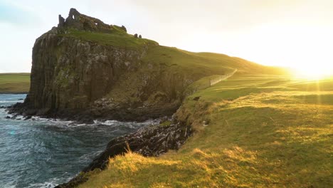 The-Duntulm-Castle-ruins-are-seen-at-sunset-on-the-Isle-of-Skye-in-Scotland