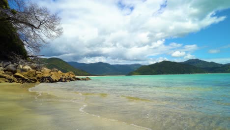 Waves-lap-the-sand-at-Motukiekie-Beach-on-New-Zealand's-South-Island