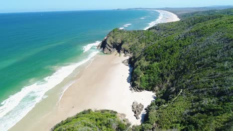 An-Aerial-View-Shows-Waves-Lapping-At-Whites-Beach-In-Byron-Bay-Australia-2