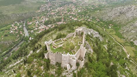 An-Aerial-View-Shows-The-Blagaj-Fortress-Sitting-Atop-Karst-Hill-In-Mostar-Bosnia