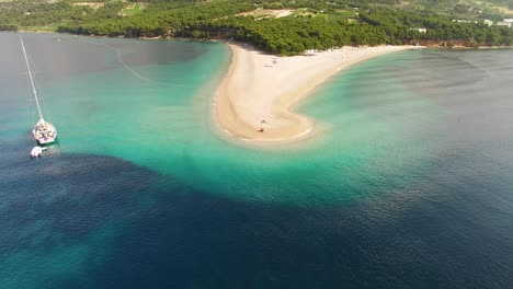 An-Aerial-View-Shows-Tourists-Enjoying-Zlatni-Rat-Beach-On-Brac-Island-Croatia