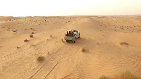 Tourists-Drive-Through-A-Desert-In-Dubai-United-Arab-Emirates