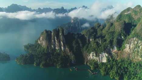 An-Aerial-View-Shows-Green-Mountains-And-Harbor-Lodgings-Among-The-Clouds-At-Khao-Sok-National-Park-In-Surat-Thani-Thailand-2