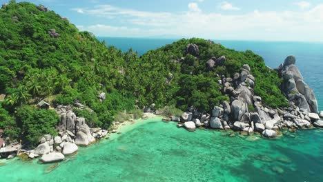 An-Aerial-View-Shows-Tourists-Exploring-A-Rocky-Harbor-Of-Ko-Tao-Thailand