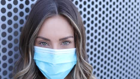 A-cleared-female-nurse-poses-in-a-close-up-portrait-during-the-Covid19-coronavirus-pandemic-epidemic