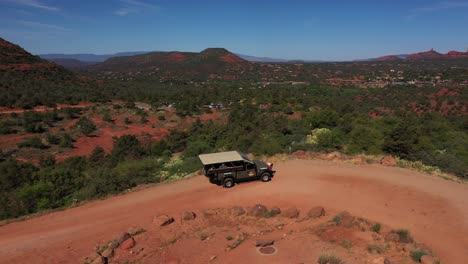 Aerial-over-jeep-driving-through-the-rugged-backcountry-on-dirt-roads-near-Sedona-Arizona-1