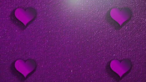 Animation-closeup-motion-small-romantic-hearts-on-purple-Valentines-day-shiny-background