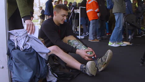 A-Man-Puts-On-A-Prosthetic-Leg-Before-An-Athletic-Event